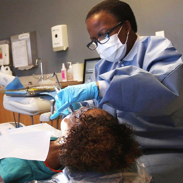 A dentist providing dental care to a patient