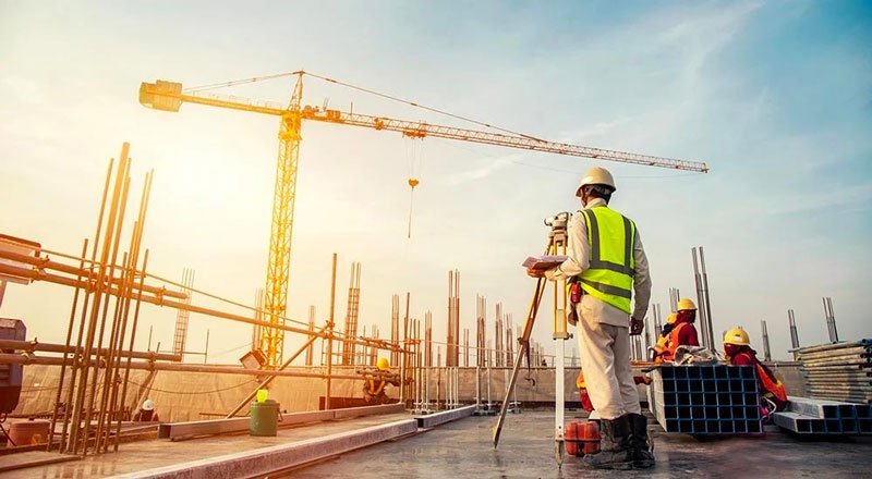 Construction workers and equipment on a building site