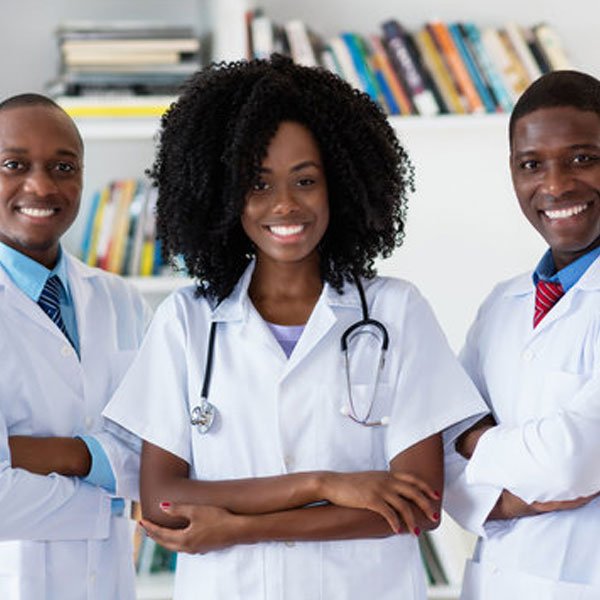 Medical professionals wearing white coats and stethoscopes